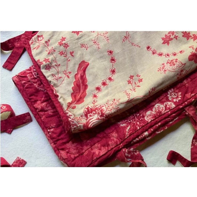 That red. Deep, warm, faded just enough — the color that's been working in French bedrooms for two hundred years and still...