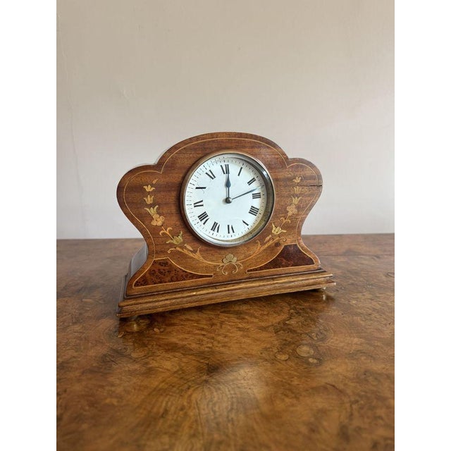 Quality antique Edwardian mahogany inlaid mantle clock, having a quality mahogany shaped case with attractive trailing...