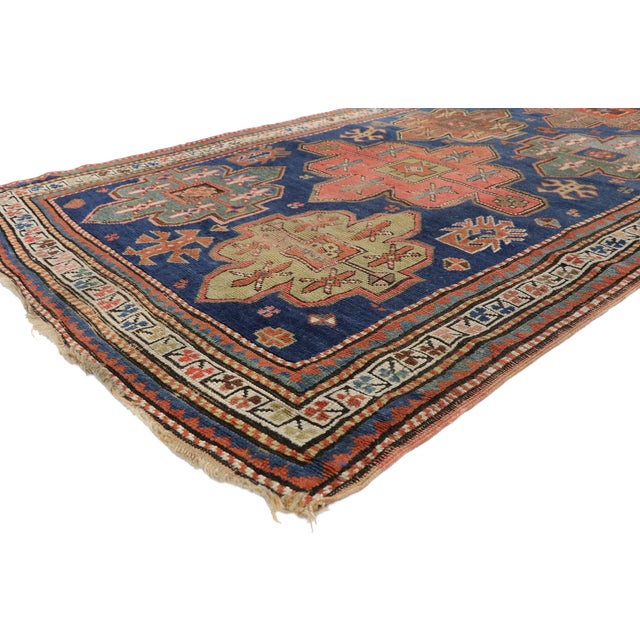 77013 Antique Caucasian Kazak Rug 04'01 x 09'10. The Guardian Lineage: An Antique Caucasian Kazak Masterpiece of Tribal...