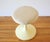 This is a mid century modern Eero Saarinen style vanity seat stool that has the iconic tulip base, and an upholstered seat...
