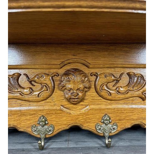 This elegant Vintage French coat hanger wall shelf showcases beautifully carved wood with decorative scrollwork and...