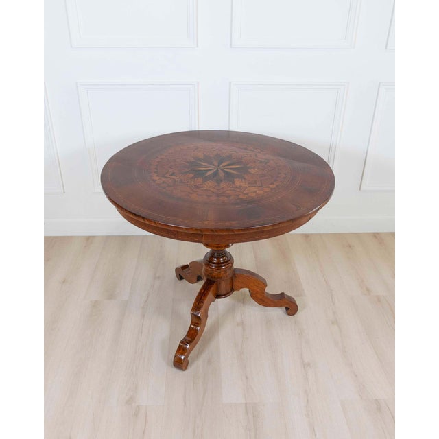 An exceptional Italian round center table from Rolo, dating to the first half of the 19th century, celebrated for its...