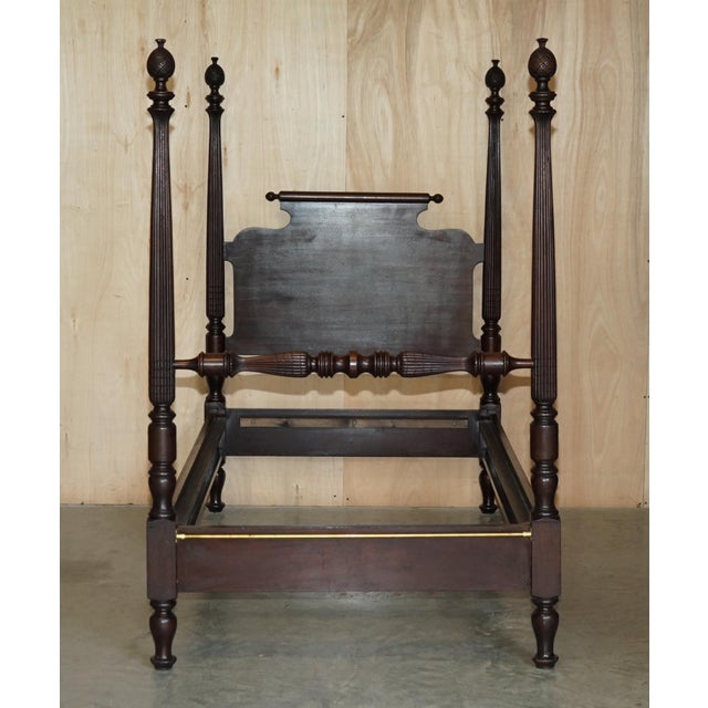 This is a very rare original circa 1800 American Federal Mahogany four post bed with heavily carved and fluted columns....