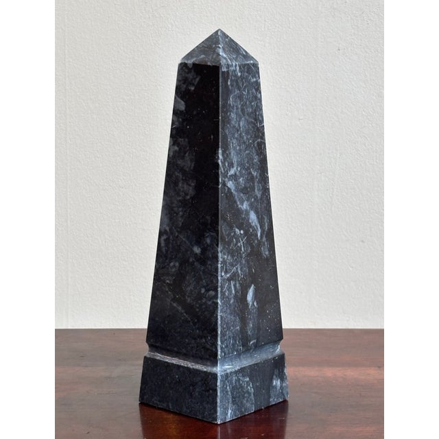 Offering a beautiful 10" Neoclassical-style black marble obelisk from the mid- to late-20th century. Love the natural...
