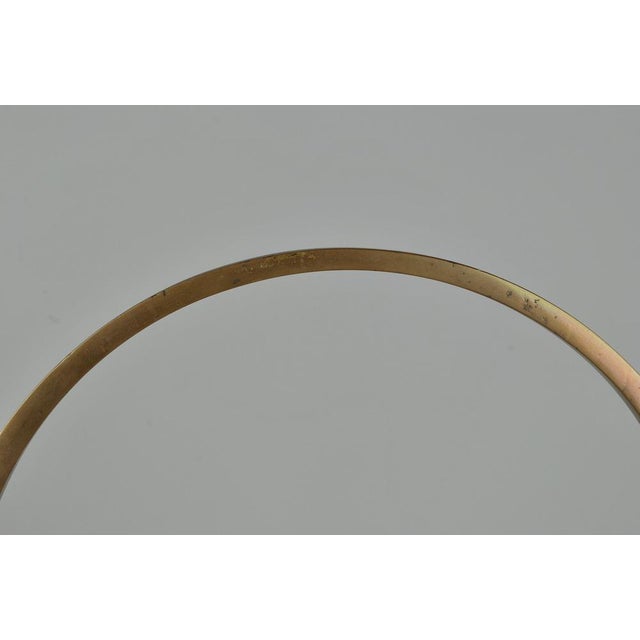 Sculpture in bronze, circle and disc on a base in black lacquered wood; the sculpture and the base are removable The...