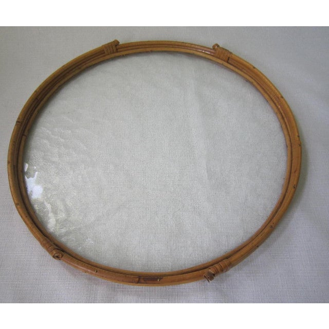 Fabulous vintage rattan and glass servicng try by Laurids Lonborg. It meaures 14.75"D and 1"H and is in excellent condition