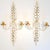 A pair Bagues style decorative wall candle holders with Rock Crystal. They feature a beautiful foliage motif with gold...