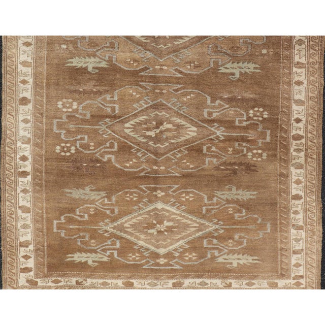 Measures: 6'0" x 9'0" Tribal Medallion Design Turkish Antique Kars Oushak Rug in Warm Brown Tones. Keivan Woven Arts / rug...