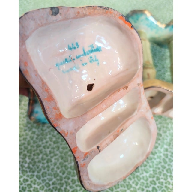 A rare pair of Italian ceramic faux bamboo colorful double candle stick holders. The colors are vibrant with greens,...