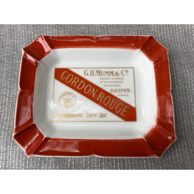 A vintage advertising catchall, ashtray made for Champagne producer G.H. Mumm & Co. G.H. Mumm & Co. Gordon Rouge bottle...