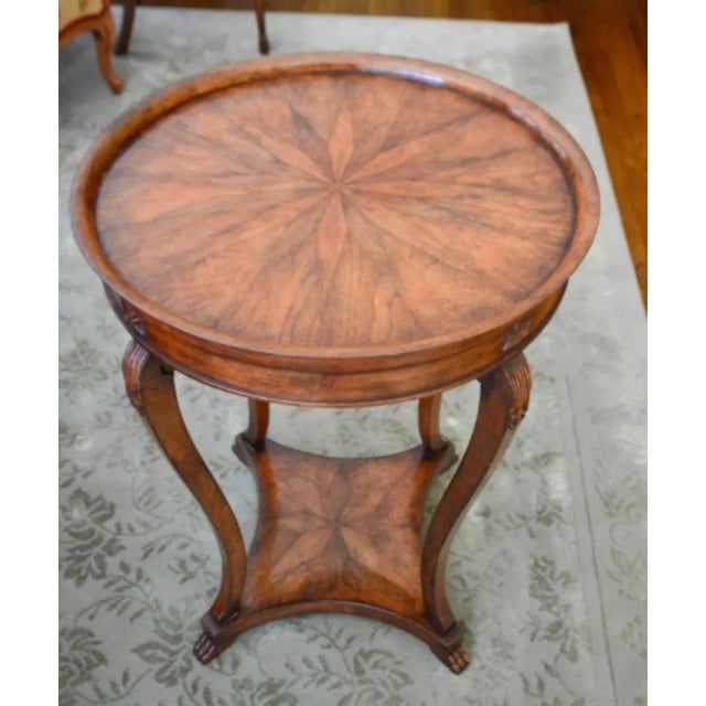 A lovely Michael Taylor Panache Designs Directoire French style occasional table with a center starburst inlay and carved...