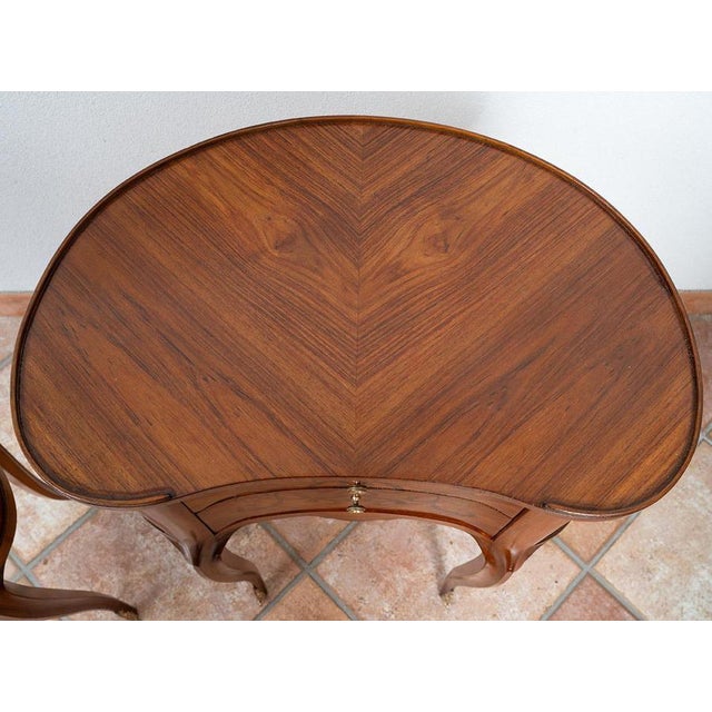 Pair of antique bedside tables with a unique shape, crafted from fine exotic woods with intricate inlay work; 2 drawers;...