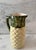 Vintage handmade ceramic pineapple pitcher with a handle. Hand painted in subtle yellow and green tones. Perfect for your...