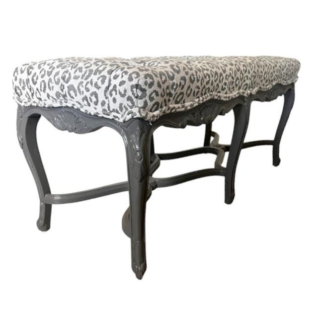 A striking vintage Double X-Base Bench. The sculptural frame features an elegant carved silhouette with distinctive...