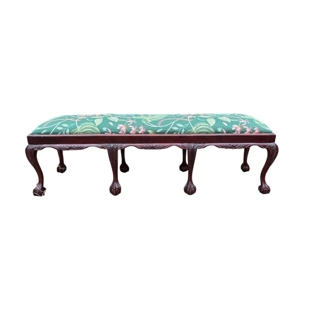 This 20th‑century Chippendale‑style mahogany bench features a lift‑top seat and a classic six‑leg design with traditional...