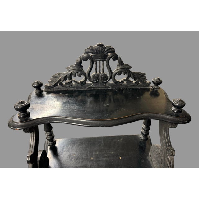 Antique Napoléon III Ebonized Carved Fruit Wood Curio Canterbury Music Stand features three shelves, three slatted...