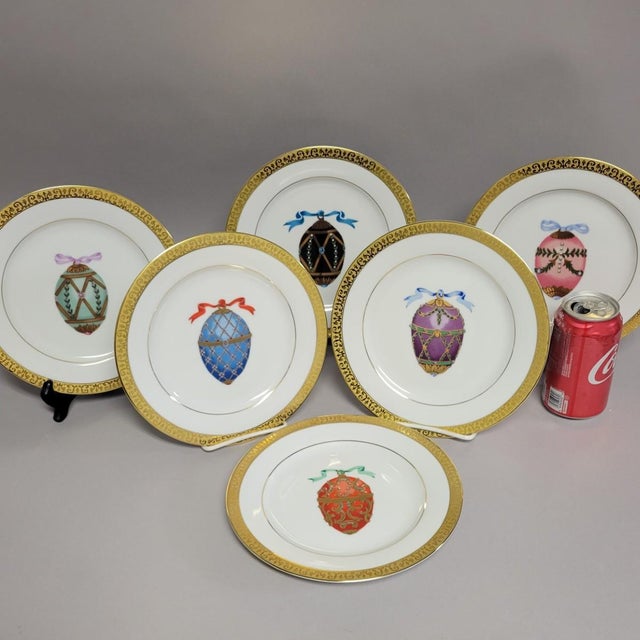 A rare and luminous set of six “Gold Buffet Egg” porcelain salad plates by Royal Gallery, Each plate features a different...