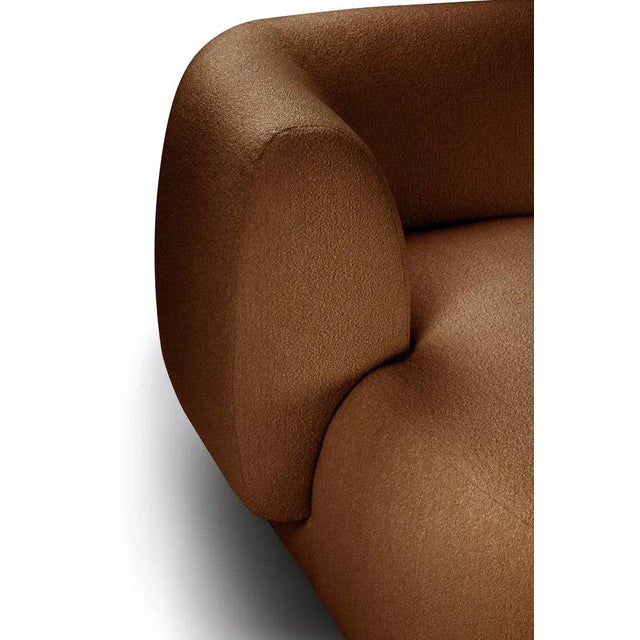 Hug sofa is defined by clean, simple lines and a distinctive armrest detail. The armrest, half overlapping the seat...