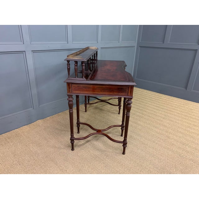A very fine quality writing table by the prestigious London firm of cabinet makers, Collinson and Lock. Made in the third...