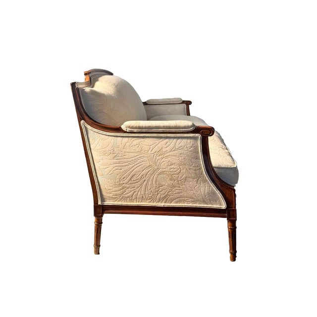 Antique late 19th Century French Louis XVI style sofa. With feather cushion. Recently upholstered in a neutral textured...