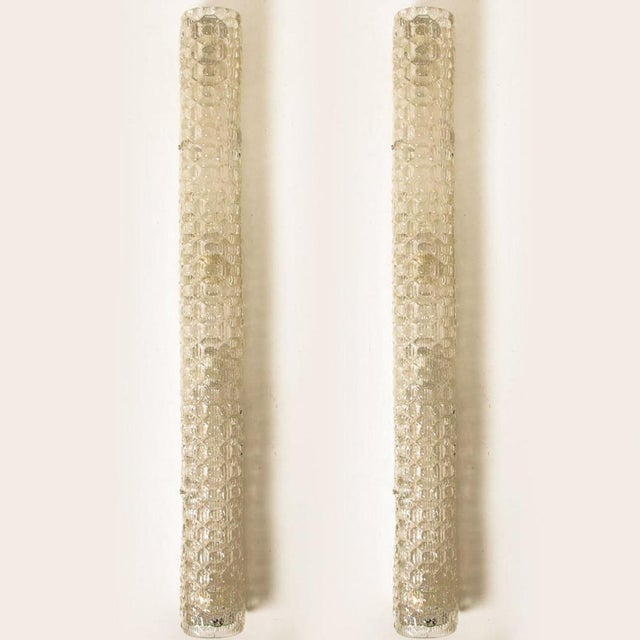 Clean lines to complement all decors. Elegant and high-end wall light fixtures with white backplate and thick bubbled...