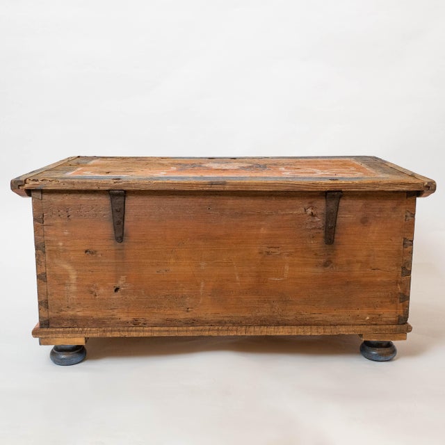 A beautifully preserved 19th-century hand-painted wedding chest, likely from Central or Eastern Europe, featuring richly...