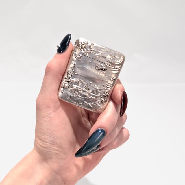 A fine antique signed silver Art Nouveau fish-themed matchsafe. By R. Blackinton & Co. In sterling silver. With repousse...