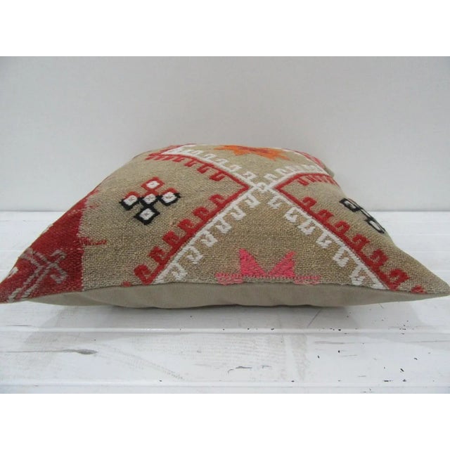 This is a pillow cover made from a vintage kilim rug. The piece was properly washed and ready to use. Pillow inserts not...