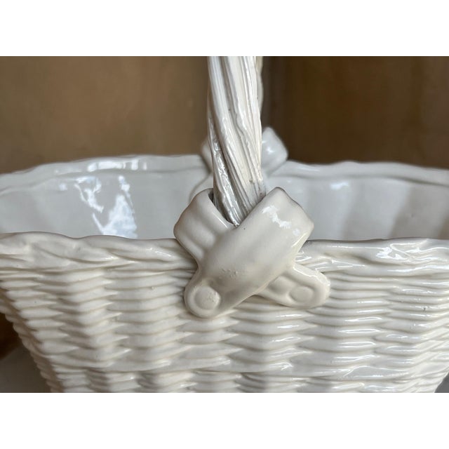 Vintage Italian ceramic basket with top handle and a cross design on each side.