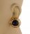 Brand: Chanel Hallmark: Chanel 25 Made in France Material: yellow gold plated metal Stone: dark purple cabochon stone....