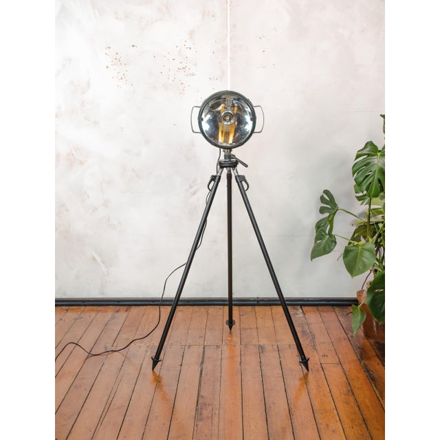 This floor lamp is crafted from an original bosch eisemann military searchlight, once used on military vehicles, as a...