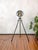 This floor lamp is crafted from an original bosch eisemann military searchlight, once used on military vehicles, as a...