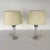 Dimensions: H 22.5” x W (lampshade) 12.5” Pair of vintage British clear glass and aluminum Column table lamps with beige...
