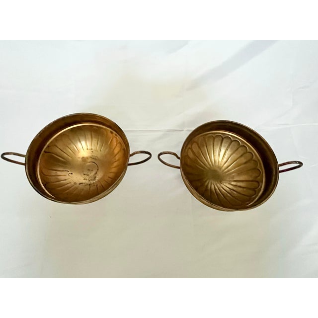 Add timeless charm to your decor with this vintage pair of brass trophy urns, beautifully aged with authentic patina and...