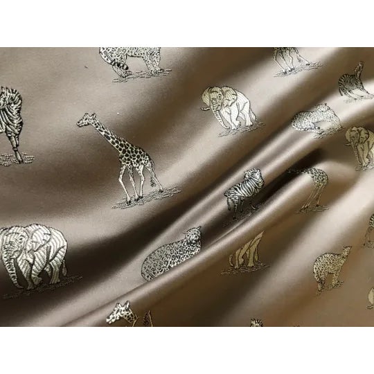 Stunning home decor fabrics with an animal pattern: zebras, elephants, cheetahs and giraffes. The fabric is in cafe au...