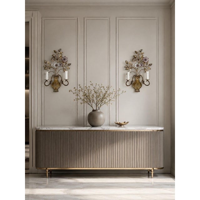 Truly enchanting pair of highly decorative wall sconces, crafted in the elegant spirit of the Italian Florentine style....