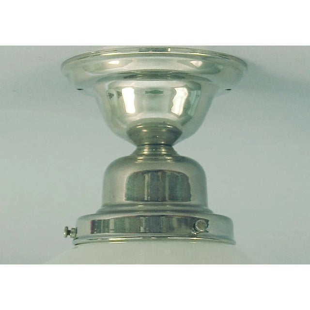 Offering a very high quality light fixture of unknown age. Chrome finish over solid brass, which means it's top quality...