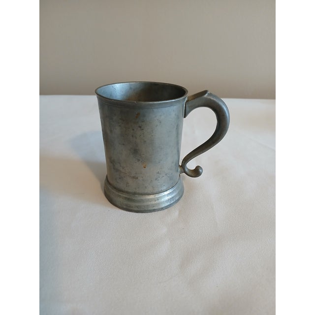 Antique pewter tankard. No markings that I can see. Has area that is a little bent as you can see from picture. Otherwise,...