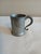 Antique pewter tankard. No markings that I can see. Has area that is a little bent as you can see from picture. Otherwise,...