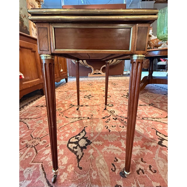fresh from restoration, this absolutely lovely Louis XVI period console game table is the cat's meow!