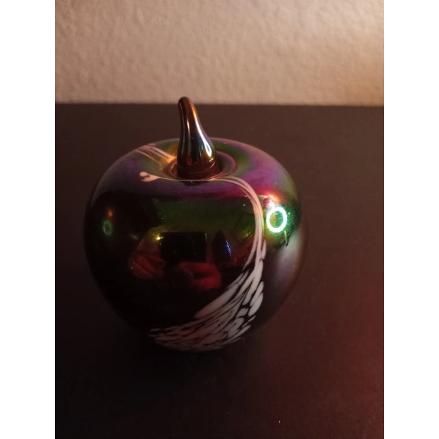 This is a Silvestri Italy Iridescent Art Glass 3.5" Apple Shaped Paperweight. Procured at auction
