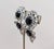 Rare 1990s rhodium plated round and pear shaped faux-onyx surrounded by round, pear and marquise clear rhinestones two...