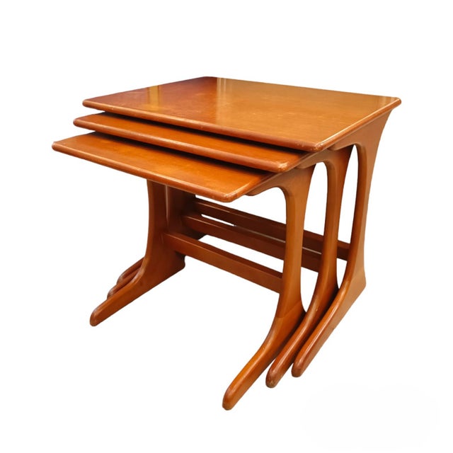 This set of three tables maintains the typical aesthetic of the Mid-Century style, with clean lines, simple geometric...