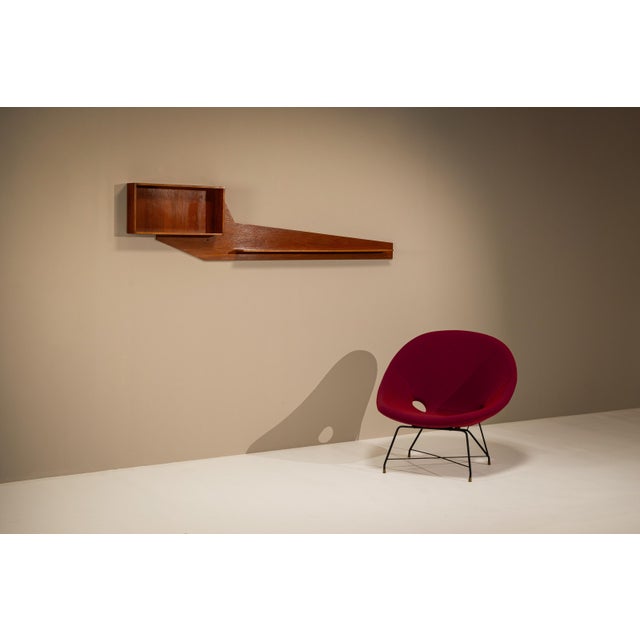 Italian furniture of the 1970s often approached storage as part of the architecture of a room. This wall-mounted shelving...
