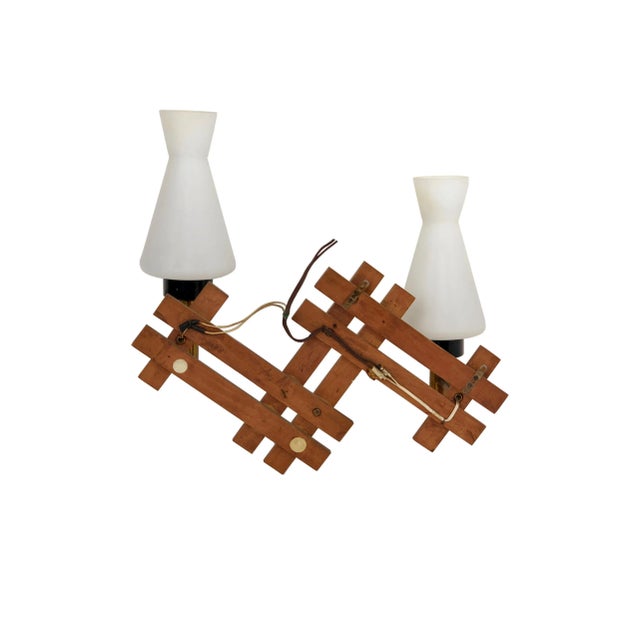 Teak and brass wall sconces featuring two lights in opaline glass, made in Italy during the 1960s. Up to 250V (Europe/UK...