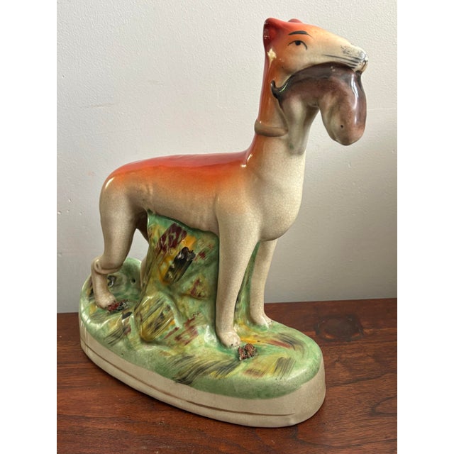 1980s Chinese export whippet dog holding fish, made after the Staffordshire style. Handsome and commanding. Please see...