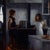 This artwork depicts a moment in a kitchen where a woman and a girl engage in a quiet conversation, the pot on the stove...