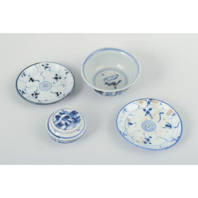 Four pieces of porcelain, korea. A collection of four porcelain pieces with blue-and-white decoration: one bowl, two...