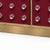 A sculptural italian dry bar in a saturated burgundy murano glass finish, with 40 clear glass spheres arranged across the...