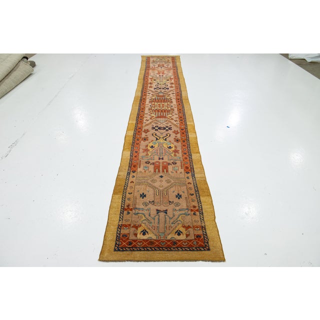 Experience the timeless elegance of a North West Persian hand-knotted wool rug. This runner is part of our Revival...